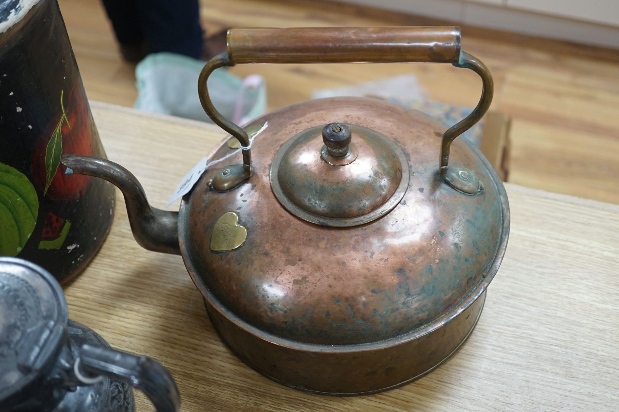 A Copper love token kettle, Georgian copper haystack measure, liberty & Co pewter teapot and a decorative papier mache bucket.